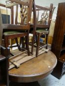 Late nineteenth century circular extending dining table with single column on heavily carved