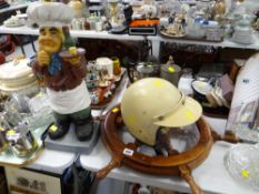 Decorative wooden ship's wheel, vintage crash helmet, plaster chef figure