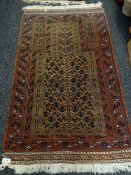 A Middle Eastern wool prayer rug in a blue & rust pattern, 160 x 96cms