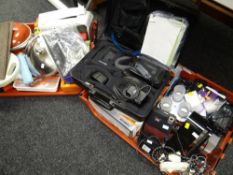 Two crates of various household items including a Blaupunkt video recorder, laptop stand, kitchen