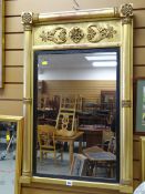 A gilt & ebonized decorated wall mirror