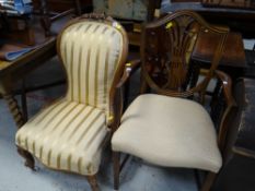 An antique walnut nursing chair upholstered in a gold & cream Regency stripe fabric together with
