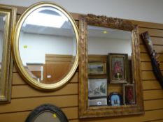 A modern ornately carved gilt & painted bevelled wall mirror together with a gilt framed &