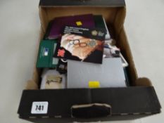 A collection of Royal Mint uncirculated coin packs including the Millennium coin, Brunel 2008 United