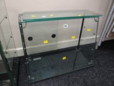 A slope-front counter top display cabinet with glass sliding door & shelves