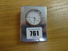 A small modern hallmarked silver clock