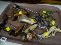 A collection of novelty corkscrews & bottle openers (in cabinet)