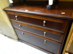 A modern mahogany effect three-drawer chest of drawers