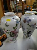 A pair of Franklin Mint John Wilkinson butterfly vases
