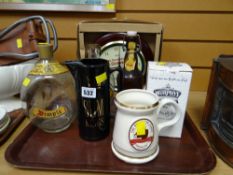 Tray of drinking related items including Dimple Whisky bottle, water jugs, Guinness clock etc