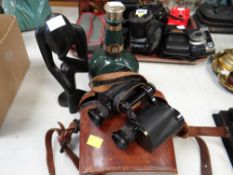 Cased set of German-made WWI binoculars, Wade whiskey bottle & carved figure