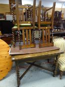 A good 1930s oak extending dining table with cross stretchers & barley-twist legs together with four