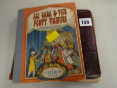 A vintage Ali Baba & the Forty Thieves, Peep Show pop up book together with a vintage autograph