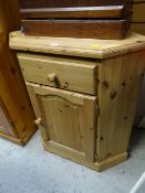 A pine standing corner cupboard, single drawer above a cupboard base