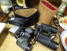 Two pairs of cased binoculars together with two pairs of miniature binoculars