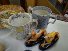 Two Staffordshire vintage loving-cups together with a pair of reclining greyhounds