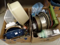 Two boxes of various kitchen items including Denby casserole dish, cake tins etc