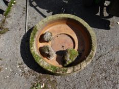 A circular stone garden planter & three small stone animals (outside)