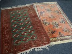 A Middle Eastern wool rug with green geometric centre, 189 x 136cms with another pale red