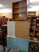 A parcel of furniture to include small sliding glass door bookcase, white chest of drawers,