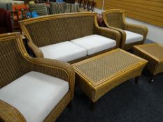 A bamboo & rattan conservatory-style suite comprising three-seater sofa, two armchairs, footstool,