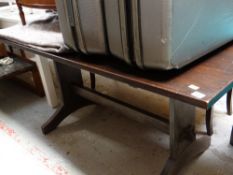 A vintage dark polished wood refectory-style dining table