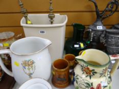 A pair of brass candelabra's together with a floral decorated pottery jug, Lord Nelson pottery
