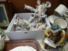 Three Continental porcelain cherub wall mounting candle sconces together with a Capodimonte-style