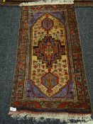 Middle Eastern brightly coloured geometric designed rug, 134 x 75cms