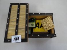 A porcupine quill sliding top box, contents including a badge, carved buckle etc
