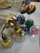 Collection of glass perfume bottles with silver rims together with Caithness & other paperweights