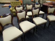 A set of seven antique mahogany cushion & carved backed dining chairs