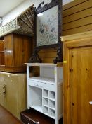 A small pine top kitchen storage unit together with a vintage carved firescreen