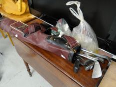 A vintage golf bag, clubs & golf balls