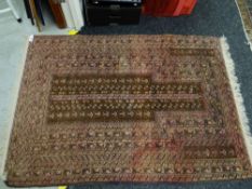 A vintage pink & brown Middle Eastern wool prayer rug, 145 x 101cms