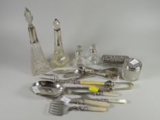 A collection of various hallmarked silver items including silver topped bottles, pickle forks,