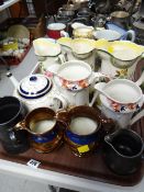 A tray of various decorated jugs including lustre, Prinknash etc