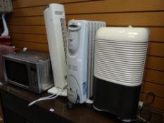 A parcel of electricals including Panasonic microwave, Delonghi oil heater etc E/T