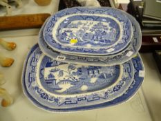 A collection of blue & white willow patterned & other platters