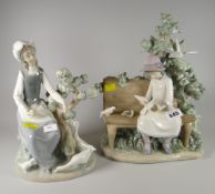 Two Nao figures - girl feeding ducks, girl feeding birds