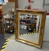 A large modern gilt frame bevel wall mirror together with another gilt frame hall mirror