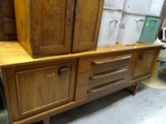 A 1960s Stateroom sideboard, three drawers flanked by two cupboards, 67 x 161 x 43cms