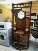 A vintage circular mirror back hall stand with tile decoration, 203 x 88cms