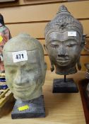 Two cast metal Buddha heads