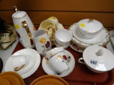A tray of various patterned teaware