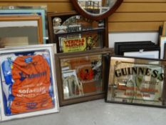 Collection of reproduction advertising mirrors together with a framed cycle shirt