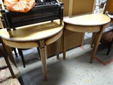 A pair of painted wood column leg demi-lune hall tables, 82 x 89 x 45cms