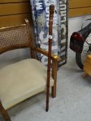 A circa 1900 Japanese bamboo walking cane which opens to a fishing rod, body engraved with flintlock