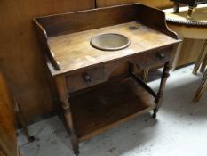 An antique mahogany wash stand