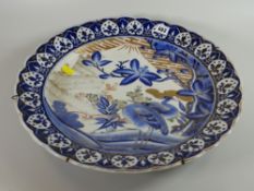 A large blue & gilt glazed Oriental charger